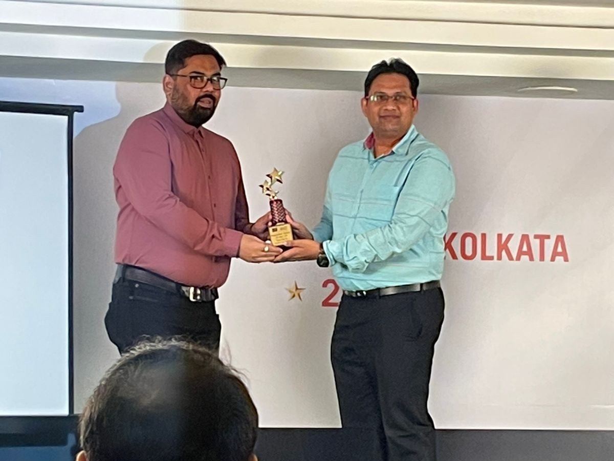Receiving a sales award on stage in Kolkata